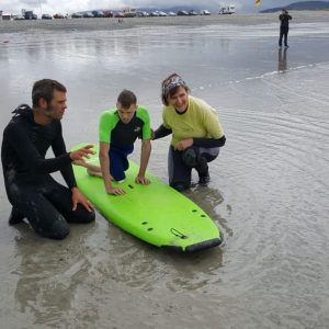 Igor taking a suft lesson during his first time braving the sea