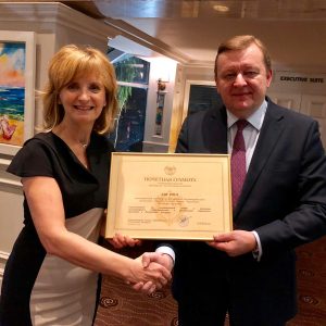 Ambassador Sergei Aleinik bestows Adi Roche with a certficiate of distinction